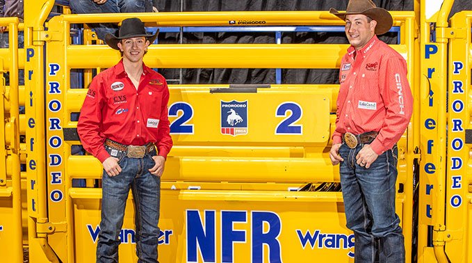Kolby Wanchuk (left) and Scott Guenthner (right) in front of a bucking shute at the NFR in Vegas.