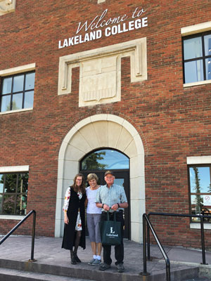 Dr. Alice Wainwright-Stewart with Armin and Rita Mueller outside Alumni Hall, Vermilion campus.