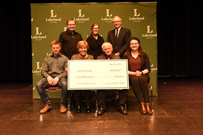 Rita and Armin Mueller (centre) of Canadian Rangeland Bison and Elk, present Lakeland with a $4 million donation to purchase land and establish a bison herd at the college. Joining them for the presentation are (back row from left) Ed Stelmach, honorary chair of Lakeland's Leading. Learning. The Lakeland Campaign, Dr. Alice Wainwright Stewart, Scott Webb, board chair, and (front row) students Ben Rajotte and Emmalee Williamson.