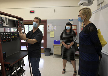Greg Barr (left) demonstrates an electric lab board  to Lakeland's Eileen Arthur and the BTPS superintendent Rhae-Ann Holoien.