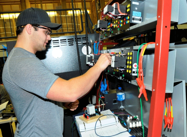 Students plugging in wires