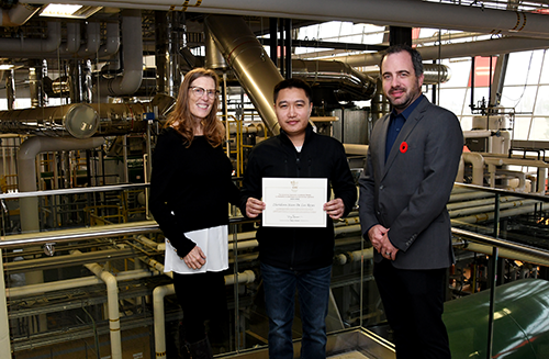 Reid De Los Reyes, Class of 2022 heavy oil power engineering program, is awarded the 2021-22 Governor General's Academic Medal from where Adam Waterman, chair of the Lakeland Board of Governors and Dr. Alice Wainwright-Stewart, president & CEO.