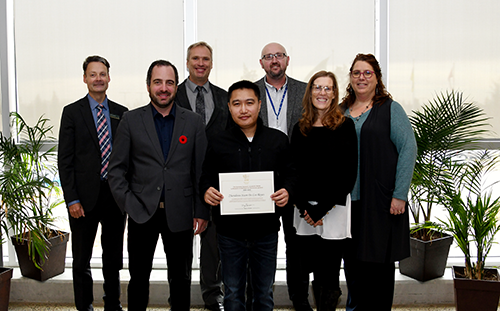 Reid De Los Reyes, Class of 2022 heavy oil power engineering program and 2021-22 Governor General's Academic Medal recipient with Adam Waterman, chair of the Lakeland Board of Governors and Dr. Alice Wainwright-Stewart, president & CEO, Todd Sumner, vice-president,academic, Georgina Altman, vice-president external relations and insfrastructure, Brad Onofrychuk, dean of Energy, and Simon Stilgoe, chair of Energy.    